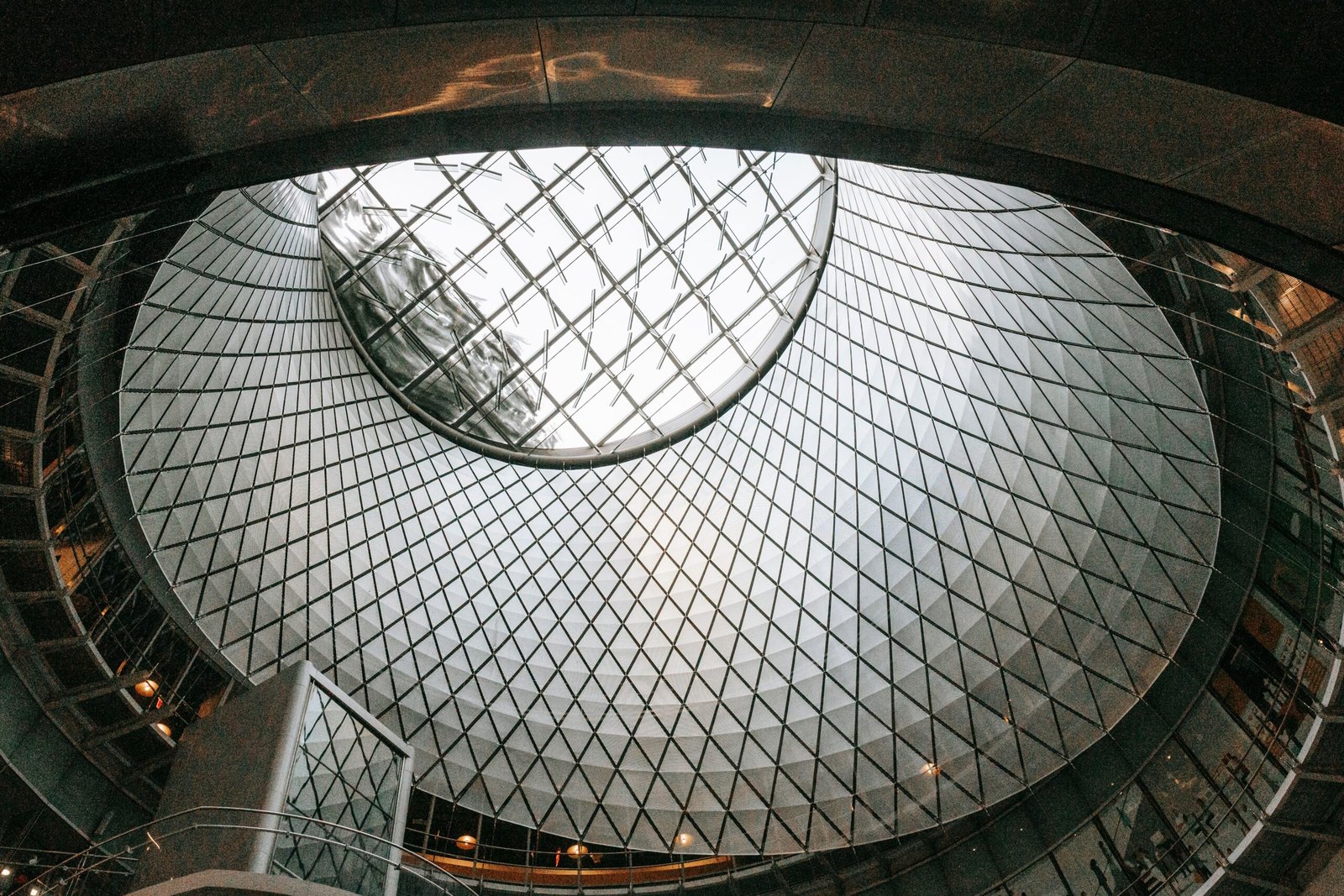 From below of glass and aluminium roof of futuristic styled subway station located in New York